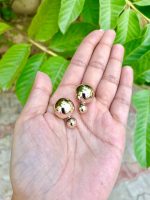 Big gold loop earrings at back