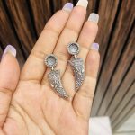 Tusk brass earrings