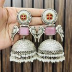 Two peacock brass earrings pink