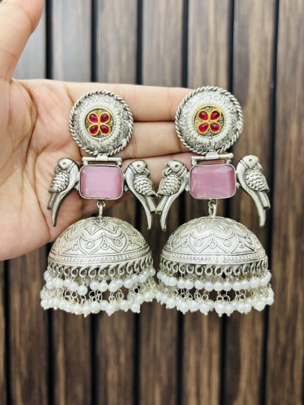 Two peacock brass earrings pink