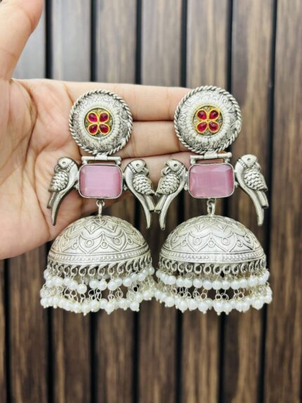 Two peacock brass earrings pink