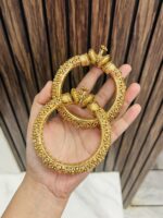 Intricate golden kade pair